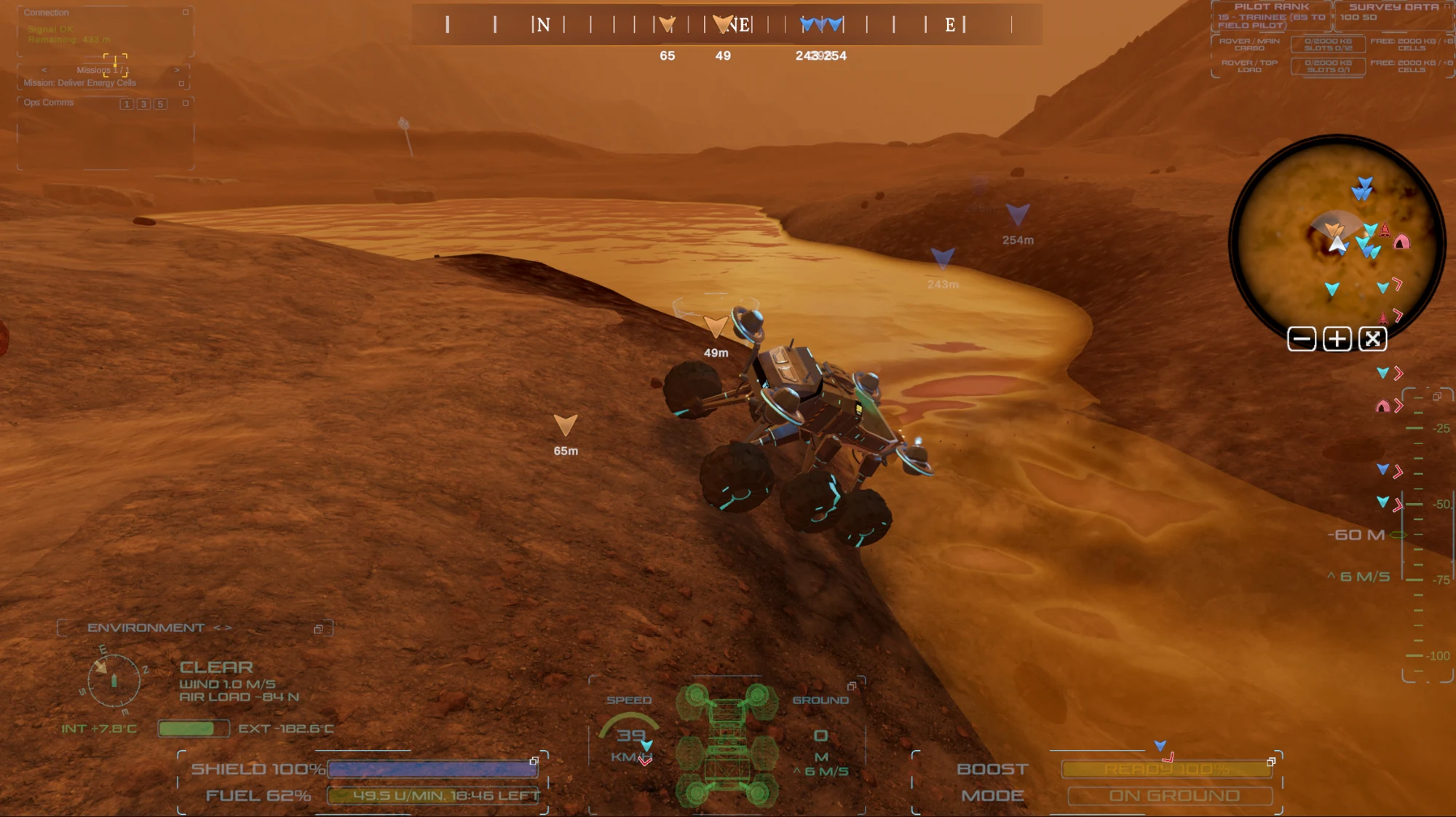 A rover follows the rocky shore of an amber methane lake.